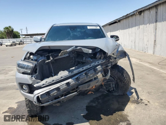 2020 Toyota Tacoma SR5 z VIN 3TMDZ5BN0LM094976, wystawiony jako Copart lot #58695515 z przebiegiem 84 025 mil mil oraz Czysty tytuł • Clean title. Historia ofert i sprzedaży dostępna na DreamBid. Obrazek 5.
