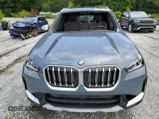 2023 BMW X1 xDrive28i with VIN WBX73EF08P5W51452, listed as a Copart auction lot 58420175 with 30,404 mi miles and Salvage title. Bid and sale history available at DreamBid. Image 5.