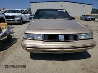1993 Oldsmobile Cutlass Ciera S z VIN 1G3AG54NXP6422819, wystawiony jako Copart lot #65294504 z przebiegiem 180 835 mil mil oraz Szkody całkowita. Historia ofert i sprzedaży dostępna na DreamBid. Obrazek 5.
