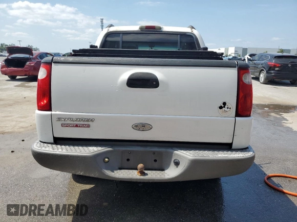 2002 Ford Explorer Sport Trac Value with VIN 1FMZU67E42UD15004, listed as a Copart auction lot 54129135 with 129,952 mi miles and Salvage title. Bid and sale history available at DreamBid. Image 6.