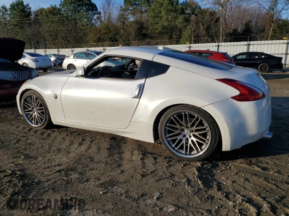 2014 Nissan 370Z Touring with VIN JN1AZ4EH8EM631324, listed as a Copart auction lot 85573524 with 0 mi miles and Salvage Title. Bid and sale history available at carsss.com. Image 2.