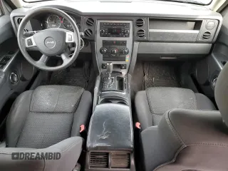 2010 Jeep Commander Sport with VIN 1J4RG4GK5AC119433, listed as a Copart auction lot 87657265 with 212,973 mi miles and Salvage title. Bid and sale history available at DreamBid. Image 8.