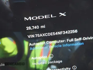 2022 Tesla Model X with VIN 7SAXCDE54NF342256, listed as a IAAI auction lot 41991212 with 28,740 mi miles and . Bid and sale history available at DreamBid. Image 15.