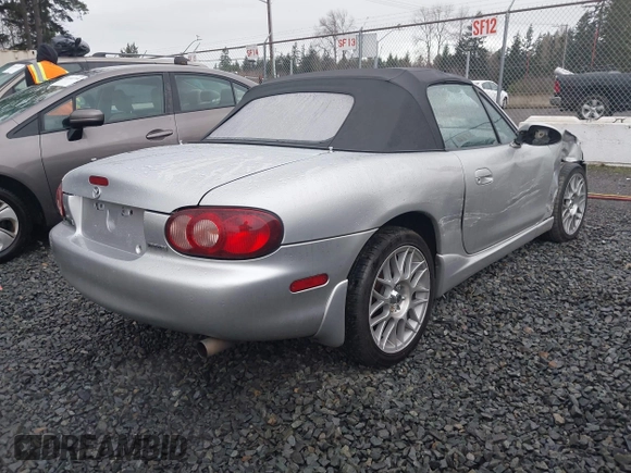 2002 Mazda MX-5 Miata Cloth z VIN JM1NB353620221304, wystawiony jako IAAI lot #41178747 z przebiegiem 98 958 mil mil oraz . Historia ofert i sprzedaży dostępna na DreamBid. Obrazek 4.