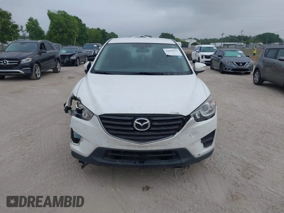 2016 Mazda CX-5 Sport with VIN JM3KE2BY1G0875484, listed as a IAAI auction lot 41838122 with 166,986 mi miles. Bid and sale history available at carsss.com. Image 12.