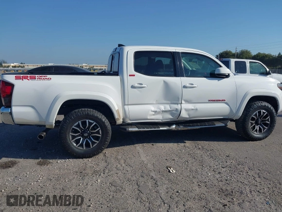 2018 Toyota Tacoma SR with VIN 5TFAX5GN2JX128621, listed as a IAAI auction lot 41797514 with 216,251 mi miles and . Bid and sale history available at DreamBid. Image 6.
