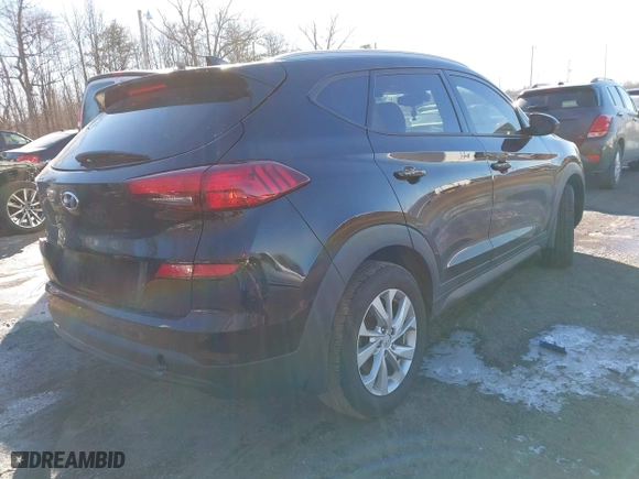 2019 Hyundai Tucson Value with VIN KM8J33A4XKU979791, listed as a IAAI auction lot 41255630 with 90,807 mi miles. Bid and sale history available at carsss.com. Image 4.