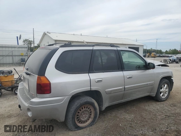 2005 GMC Envoy SLT with VIN 1GKDT13S852330514, listed as a Copart auction lot 71190504 with 203,616 mi miles and Salvage Title. Bid and sale history available at carsss.com. Image 3.