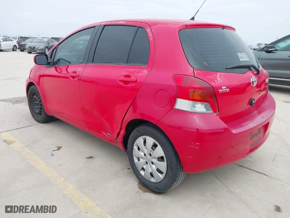 2009 Toyota Yaris with VIN JTDKT903295244022, listed as a IAAI auction lot 41615570 with 165,964 mi miles. Bid and sale history available at carsss.com. Image 3.