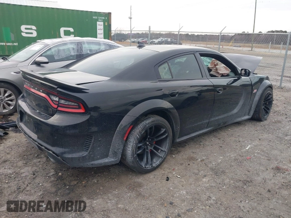 2022 Dodge Charger Scat Pack Widebody with VIN 2C3CDXGJXNH101398, listed as a IAAI auction lot 41408112 with 72,625 mi miles and . Bid and sale history available at DreamBid. Image 4.