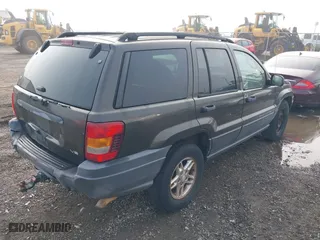 2004 Jeep Grand Cherokee Laredo with VIN 1J4GX48N74C385749, listed as a IAAI auction lot 41877421 with 141,255 mi miles. Bid and sale history available at carsss.com. Image 4.