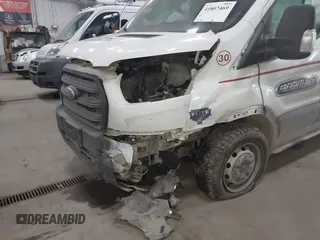 2020 Ford Transit Cargo z VIN 1FTBR1CG9LKB59461, wystawiony jako IAAI lot #41807469 z przebiegiem 205 431 mil mil oraz . Historia ofert i sprzedaży dostępna na DreamBid. Obrazek 6.