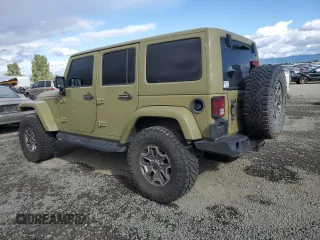 2013 Jeep Wrangler Unlimited Rubicon 10th Anniversary with VIN 1C4HJWFG4DL549065, listed as a Copart auction lot 75899594 with 127,960 mi miles and Salvage title. Bid and sale history available at DreamBid. Image 2.
