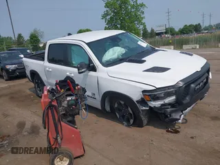 2022 Ram 1500 Rebel with VIN 1C6SRFLT5NN318494, listed as a IAAI auction lot 42413194 with 59,458 mi miles and . Bid and sale history available at DreamBid. Image 1.