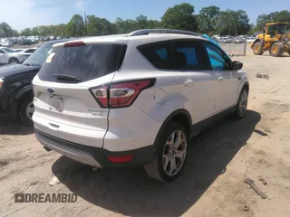 2017 Ford Escape Titanium with VIN 1FMCU0JD8HUE52149, listed as a IAAI auction lot 41974274 with 143,707 mi miles and . Bid and sale history available at DreamBid. Image 4.