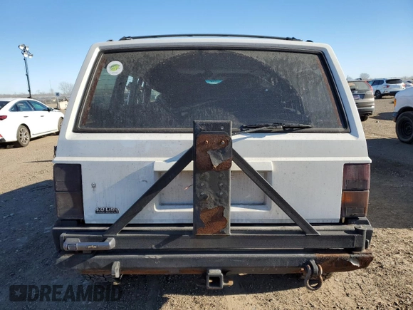 1996 Jeep Cherokee SE with VIN 1J4FJ28S0TL272778, listed as a Copart auction lot 83498634 with Not provided miles and Salvage title. Bid and sale history available at DreamBid. Image 6.