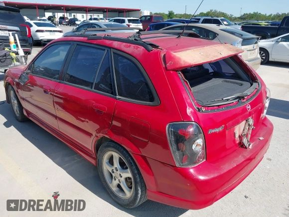 2002 Mazda Protege with VIN JM1BJ246721565634, listed as a IAAI auction lot 41984727 with 235,764 mi miles and . Bid and sale history available at DreamBid. Image 3.