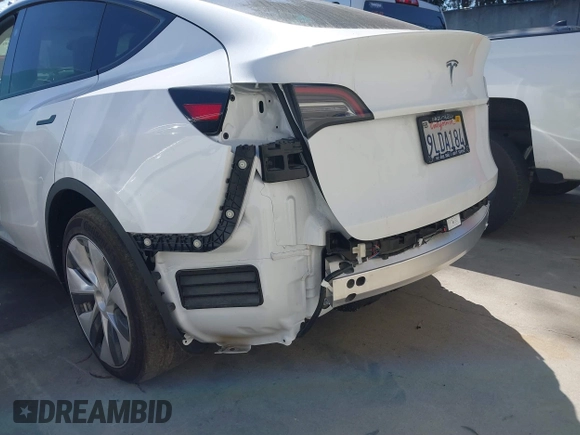 2024 Tesla Model Y with VIN 7SAYGDED2RF017448, listed as a IAAI auction lot 41597056 with 9,702 mi miles and . Bid and sale history available at DreamBid. Image 22.