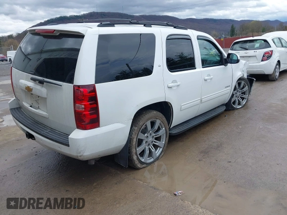 2013 Chevrolet Tahoe LT with VIN 1GNSKBE05DR293054, listed as a IAAI auction lot 41955877 with 192,474 mi miles and . Bid and sale history available at DreamBid. Image 4.