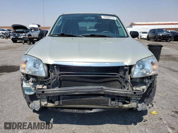 2005 Mazda Tribute i with VIN 4F2YZ02Z65KM01780, listed as a Copart auction lot 70890314 with 119,107 mi miles and Salvage Title. Bid and sale history available at carsss.com. Image 5.