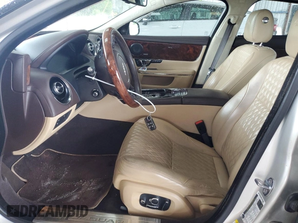 2016 Jaguar XJ Portfolio with VIN SAJWA2G70G8V93006, listed as a Copart auction lot 52324635 with 123,690 mi miles and Salvage Title. Bid and sale history available at DreamBid. Image 7.