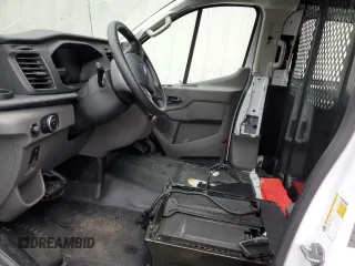 2023 Ford Transit Cargo with VIN 1FTBR1Y87PKA28570, listed as a Copart auction lot 77250383 with Not Provided miles and . Bid and sale history available at DreamBid. Image 7.