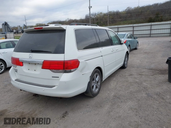 2010 Honda Odyssey Touring with VIN 5FNRL3H99AB005395, listed as a IAAI auction lot 42027445 with 181,559 mi miles. Bid and sale history available at carsss.com. Image 4.