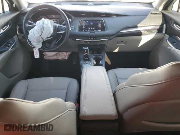 2023 Cadillac XT4 FWD Luxury with VIN 1GYAZAR42PF219114, listed as a Copart auction lot 61830125 with 23,508 mi miles and Salvage title. Bid and sale history available at DreamBid. Image 8.