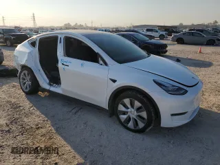 2023 Tesla Model Y Long Range z VIN 7SAYGDEE8PA069248, wystawiony jako Copart lot #74120944 z przebiegiem 17 085 mil mil oraz Szkoda całkowita • Salvage title. Historia ofert i sprzedaży dostępna na DreamBid. Obrazek 4.