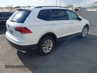 2020 Volkswagen Tiguan S with VIN 3VV1B7AXXLM036994, listed as a IAAI auction lot 42643035 with 62,676 mi miles and . Bid and sale history available at DreamBid. Image 4.