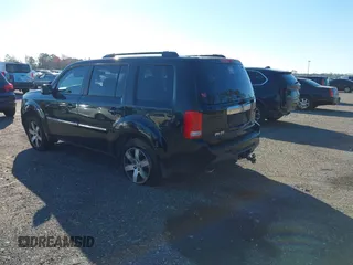 2013 Honda Pilot Touring with VIN 5FNYF4H9XDB047796, listed as a IAAI auction lot 41591189 with 188,579 mi miles and . Bid and sale history available at carsss.com. Image 3.