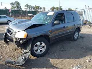 2004 Mazda Tribute LX with VIN 4F2CZ941X4KM19302, listed as a IAAI auction lot 41791389 with 123,036 mi miles. Bid and sale history available at carsss.com. Image 2.
