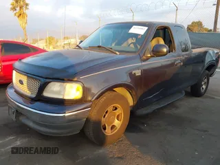 1999 Ford F-150 XL with VIN 1FTRX17L3XKB32547, listed as a IAAI auction lot 41331882 with Not Provided miles. Bid and sale history available at carsss.com. Image 2.