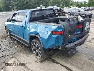 2023 Rivian R1T Adventure with VIN 7FCTGBAA5PN026063, listed as a Copart auction lot 66916194 with Not Provided miles and Salvage Title. Bid and sale history available at DreamBid. Image 2.