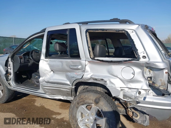 2004 Jeep Grand Cherokee Limited z VIN 1J4GW58S84C269863, wystawiony jako IAAI lot #41900325 z przebiegiem 226 587 mil mil oraz . Historia ofert i sprzedaży dostępna na DreamBid. Obrazek 6.