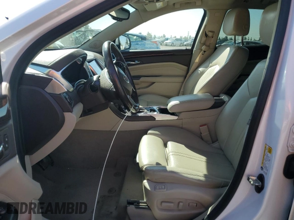 2015 Cadillac SRX Luxury Collection with VIN 3GYFNBE34FS555989, listed as a Copart auction lot 52765485 with 93,988 mi miles and Salvage Title. Bid and sale history available at DreamBid. Image 7.
