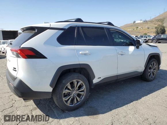 2024 Toyota RAV4 Hybrid XLE Premium with VIN JTMB6RFV6RD120633, listed as a Copart auction lot 57620825 with 28,817 mi miles and Salvage title. Bid and sale history available at DreamBid. Image 3.