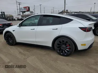 2022 Tesla Model Y Performance with VIN 7SAYGDEF1NF410241, listed as a Copart auction lot 55359505 with 42,652 mi miles and Salvage Title. Bid and sale history available at DreamBid. Image 2.