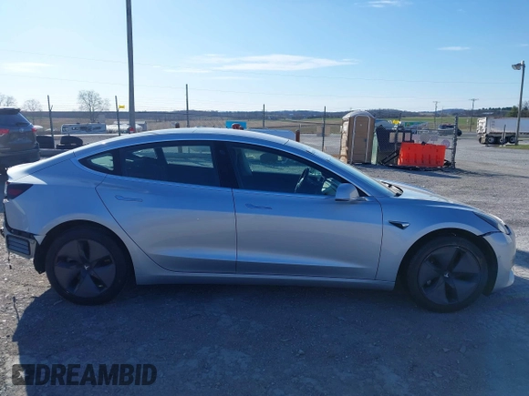 2018 Tesla Model 3 Long Range Battery with VIN 5YJ3E1EB9JF065057, listed as a IAAI auction lot 41863903 with 54,584 mi miles and . Bid and sale history available at DreamBid. Image 13.