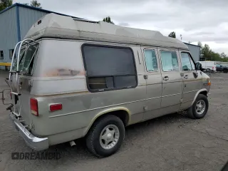 1992 Chevrolet Chevy Van z VIN 1GBEG25K2N7130047, wystawiony jako Copart lot #68682724 z przebiegiem 143 585 mil mil oraz Szkody całkowita. Historia ofert i sprzedaży dostępna na DreamBid. Obrazek 3.