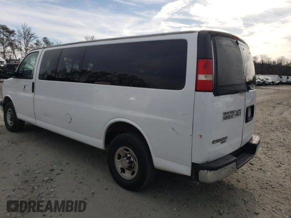 2014 Chevrolet Express Passenger LT with VIN 1GAZG1FG2E1202457, listed as a Copart auction lot 82704884 with 142,982 mi miles and Salvage title. Bid and sale history available at DreamBid. Image 2.