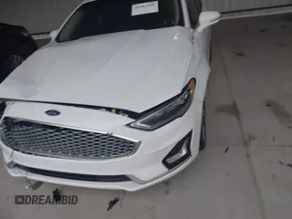 2019 Ford Fusion Titanium with VIN 3FA6P0K95KR271291, listed as a IAAI auction lot 41983320 with 71,962 mi miles and . Bid and sale history available at DreamBid. Image 19.