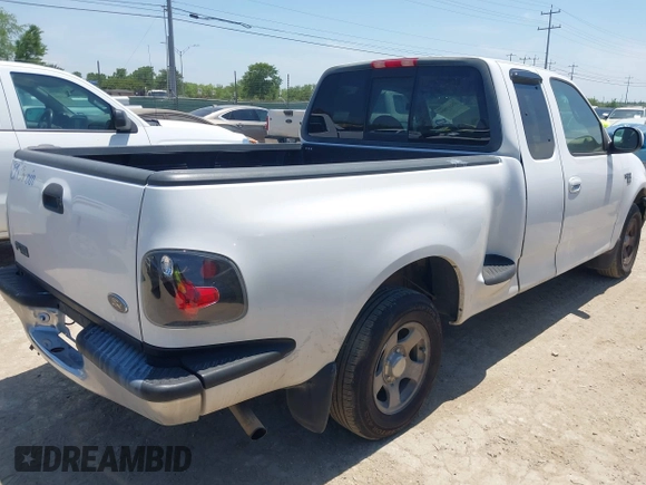 1999 Ford F-150 with VIN 1FTRX07W0XKA01385, listed as a IAAI auction lot 42247809 with 147,105 mi miles and . Bid and sale history available at DreamBid. Image 4.