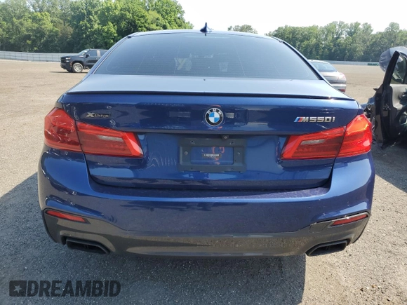 2020 BMW 5 Series M550i xDrive with VIN WBAJS7C0XLBN96338, listed as a Copart auction lot 60591815 with 73,910 mi miles and Salvage title. Bid and sale history available at DreamBid. Image 6.