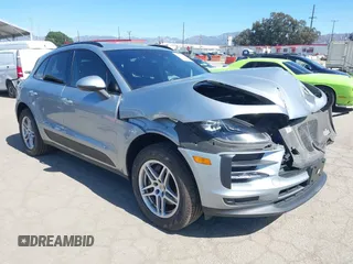 2021 Porsche Macan with VIN WP1AA2A56MLB09041, listed as a IAAI auction lot 41679110 with 56,877 mi miles and . Bid and sale history available at DreamBid. Image 1.