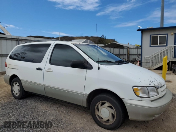 1999 Toyota Sienna LE with VIN 4T3ZF13C4XU134680, listed as a Copart auction lot 74044544 with 127,954 mi miles and Clean Title. Bid and sale history available at carsss.com. Image 4.