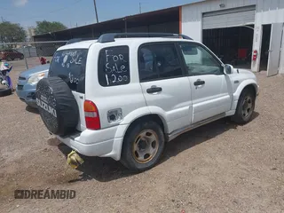 2002 Suzuki Grand Vitara JS z VIN JS3TE62VX24154819, wystawiony jako IAAI lot #42409780 z przebiegiem 160 545 mil mil oraz . Historia ofert i sprzedaży dostępna na DreamBid. Obrazek 4.