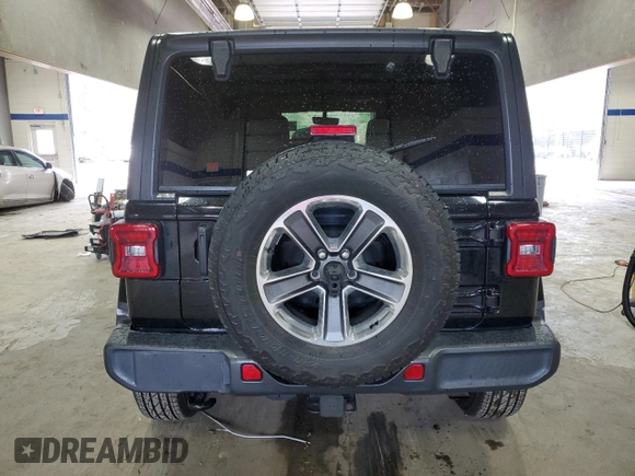 2021 Jeep Wrangler Unlimited Sahara High Altitude with VIN 1C4HJXEG9MW571844, listed as a Copart auction lot 81482334 with 77,409 mi miles and Salvage title. Bid and sale history available at DreamBid. Image 6.