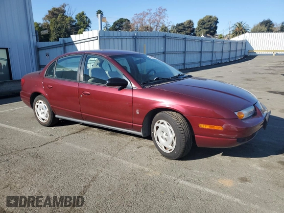 2001 Saturn SL z VIN 1G8ZK54731Z305098, wystawiony jako Copart lot #83875424 z przebiegiem 82 879 mil mil oraz Tytuł czysty. Historia ofert i sprzedaży dostępna na DreamBid. Obrazek 4.