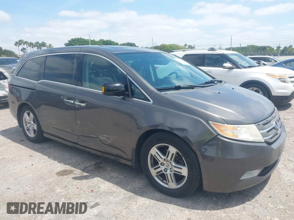 2012 Honda Odyssey Touring with VIN 5FNRL5H90CB088536, listed as a IAAI auction lot 42102008 with 283,350 mi miles and . Bid and sale history available at DreamBid. Image 1.